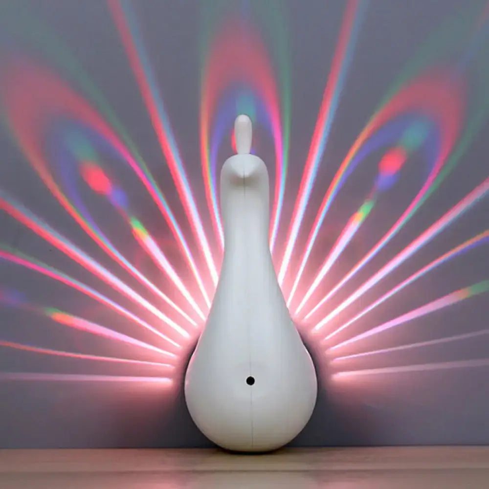 Modern peach peacock wall sconce led light projector casting vibrant rainbow-colored rays on wall for bedroom use