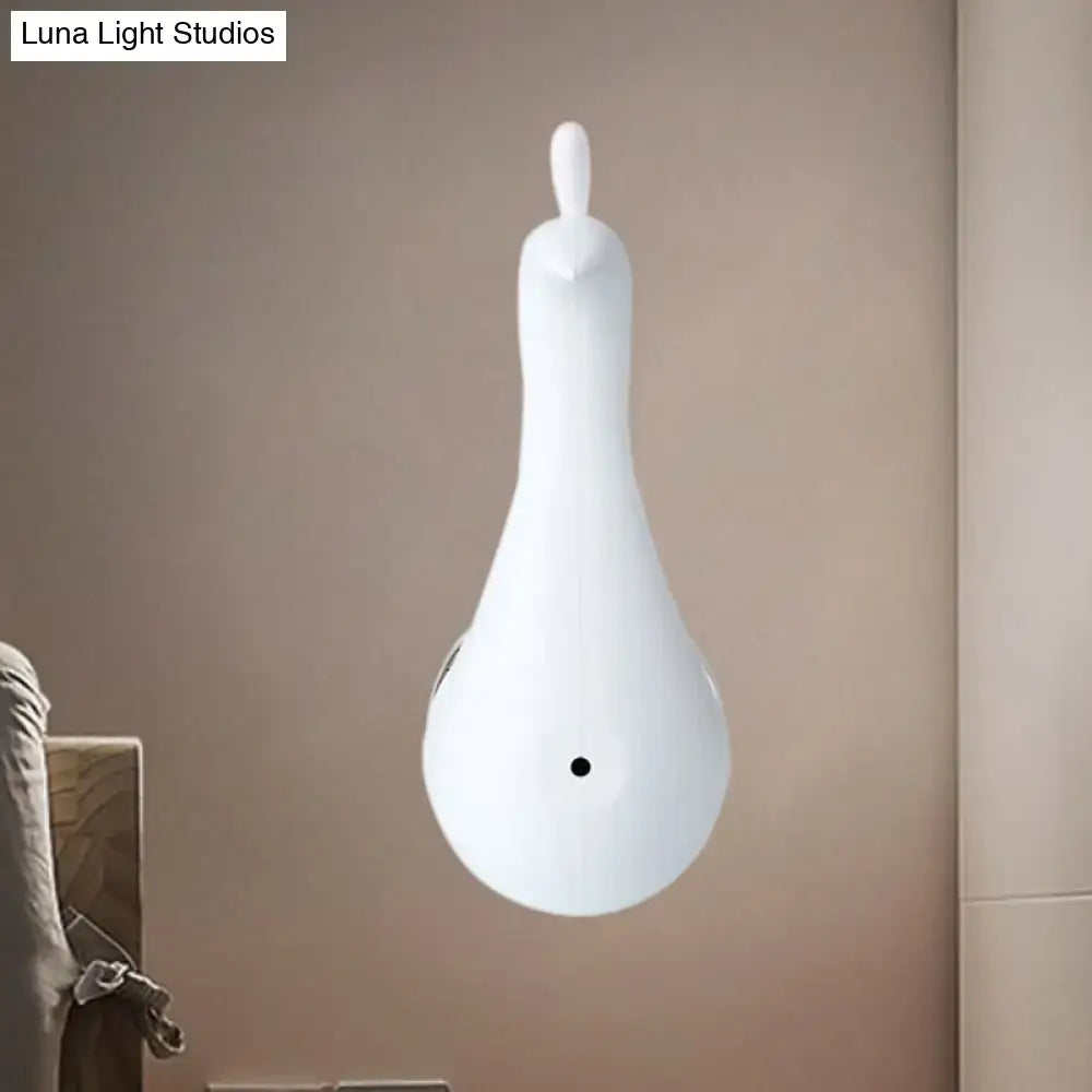 White ceramic pendant light shaped like a stylized bird for modern peach peacock wall bedroom sconce with rainbow projection