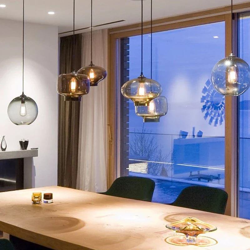 Glass pendant lights with warm glowing bulbs and black cords modern pendant lights for bedroom dining room loft decor