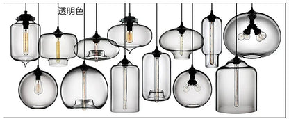 Transparent glass modern pendant lights with black metal fixtures and exposed filament bulbs for bedroom and dining room
