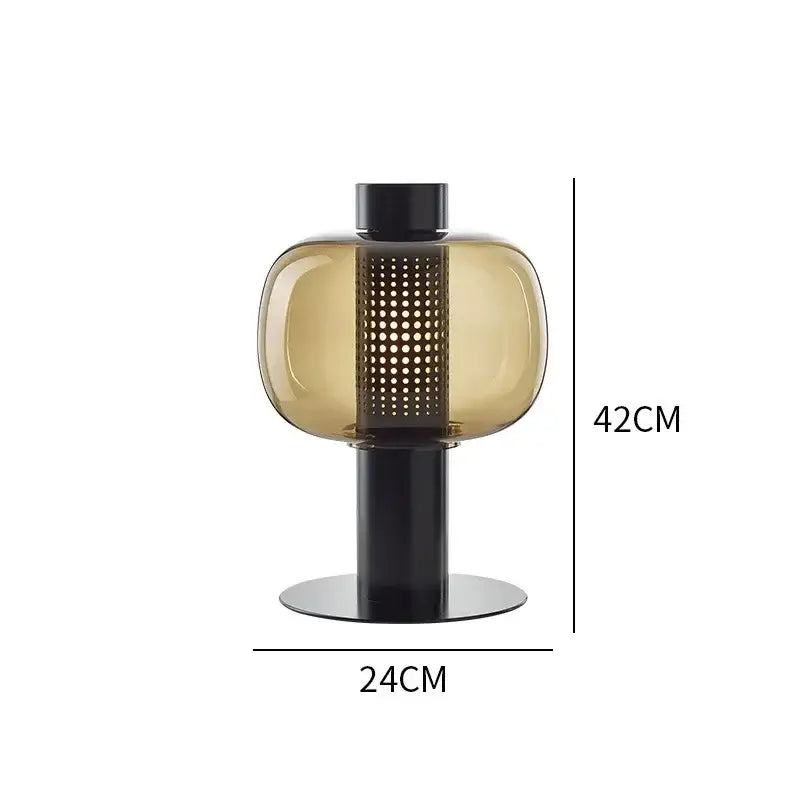 Modern perforated glass table lamp with amber shade and black metal base ideal for bedroom and living room decorbites glass table