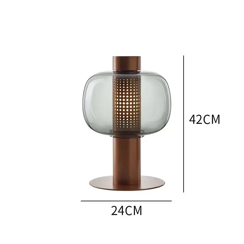 Modern perforated glass table lamp with translucent gray shade and copper cylinder on bronze base for bedroom decorbites
