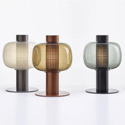 Three modern glass table lamps with perforated translucent shades and metal bases for bedroom and living room decorbites table lamp
