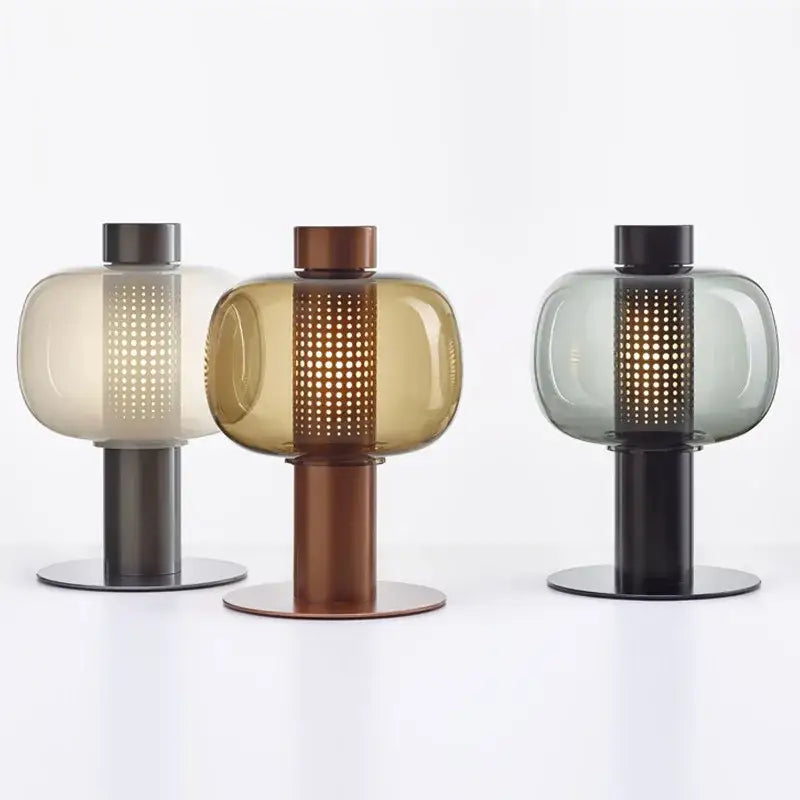 Three modern glass table lamps with perforated translucent shades and metal bases for bedroom and living room decorbites table lamp