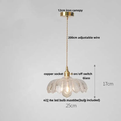 Delicate clear glass led pendant lamp with fluted petal design and brass accents for modern dining room lighting