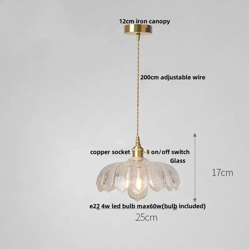 Delicate clear glass led pendant lamp with fluted petal design and brass accents for modern dining room lighting