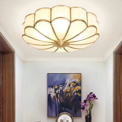 Modern petal brass ceiling lamp with gold-toned scalloped design and frosted glass panels by decorbites brass ceiling lamp