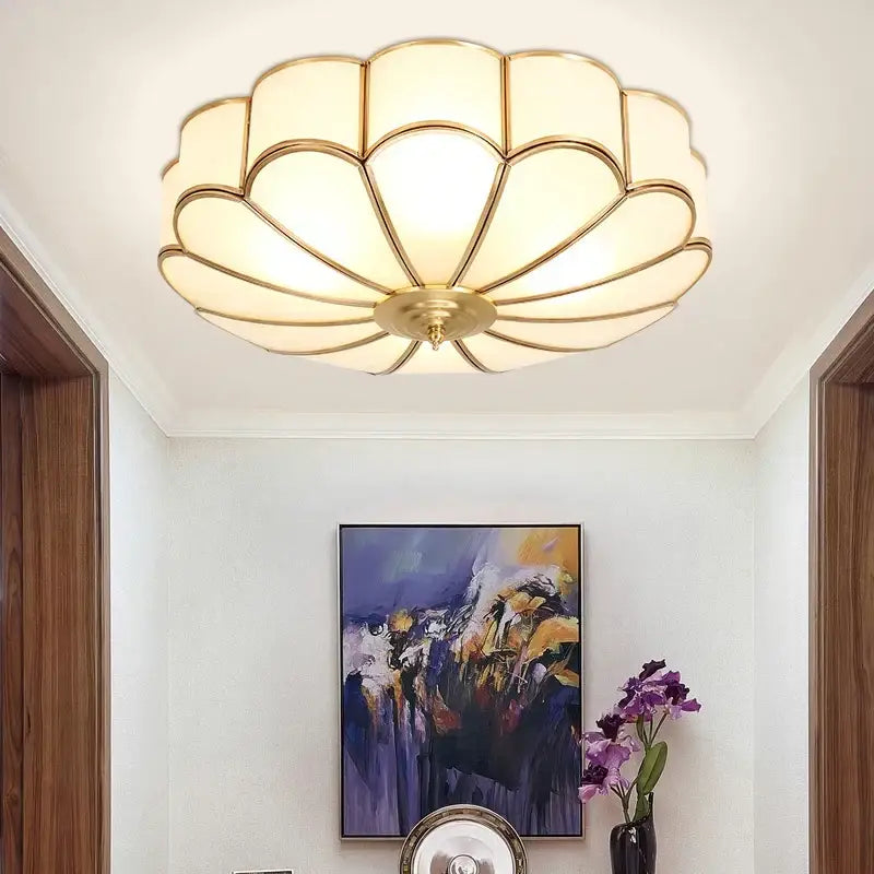 Modern petal brass ceiling lamp with gold-toned scalloped design and frosted glass panels by decorbites brass ceiling lamp