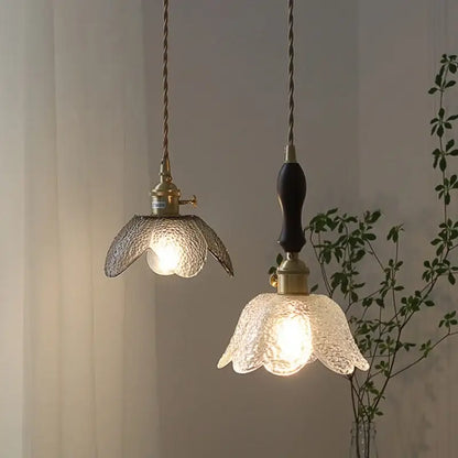 Two modern petal clear glass led pendant lamps with textured shades and brass hardware for dining room decorbites clear glass