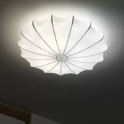 Modern petal cream silk led ceiling lamp with white translucent shell shape and black structural lines for living room decorbites cream silk