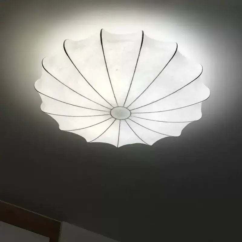 Modern petal cream silk led ceiling lamp with white translucent shell shape and black structural lines for living room decorbites cream silk