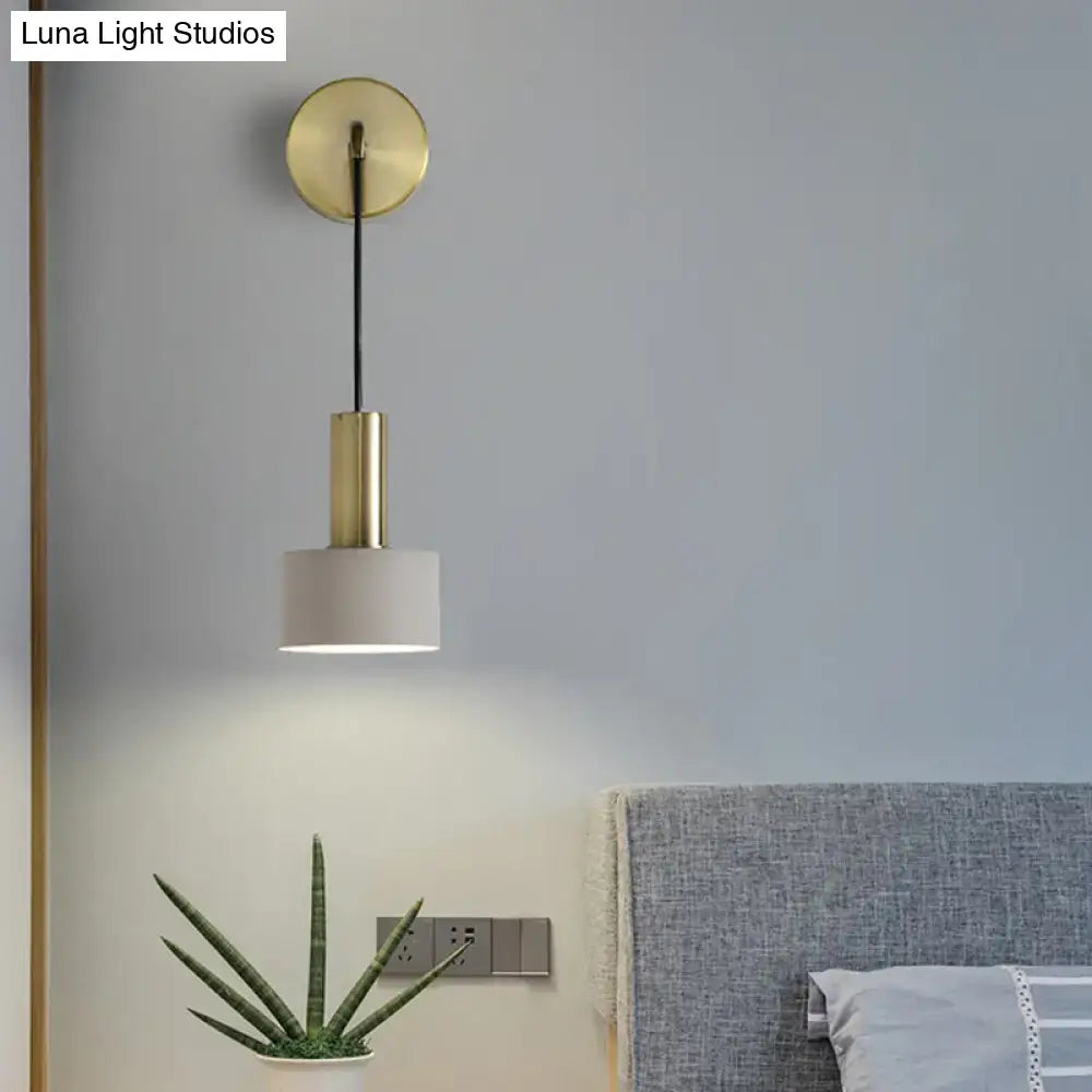 Modern pink and brass bedside reading wall sconce with brass finish cylindrical stem and white fabric shade e14 e26 e27