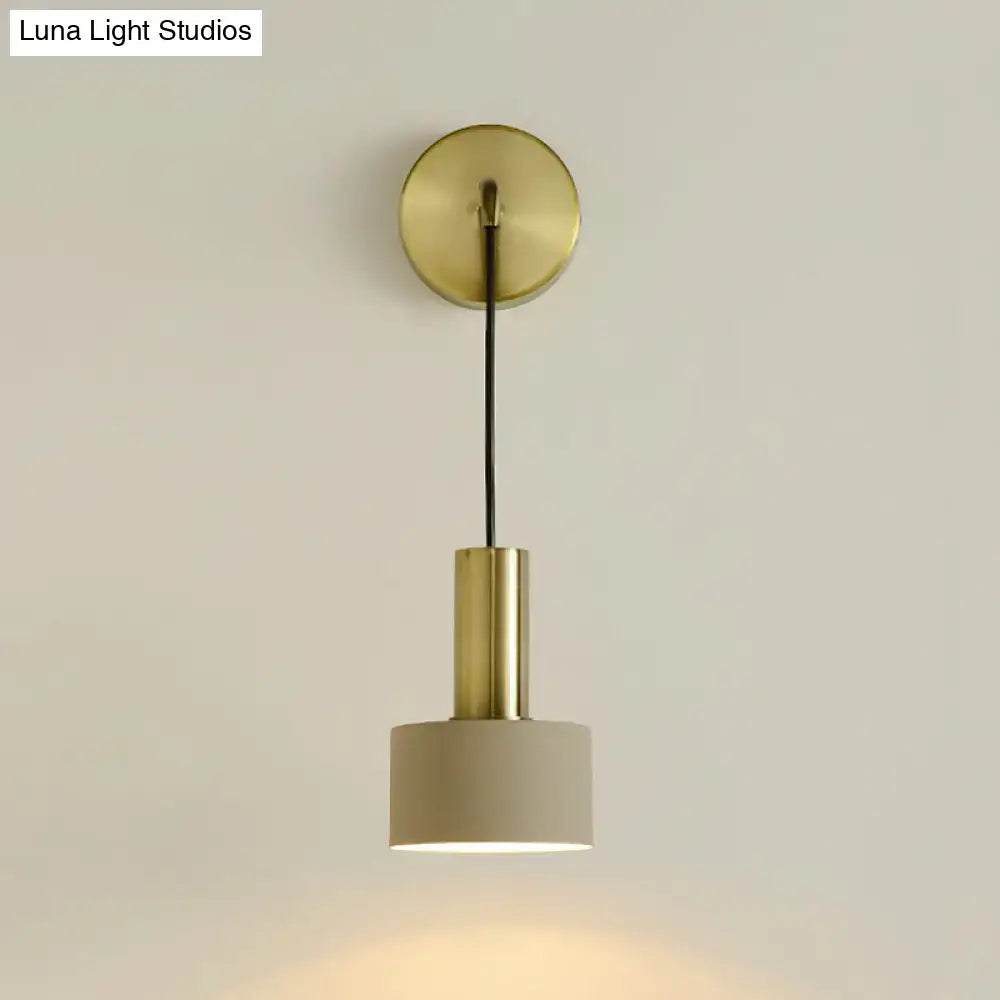 Modern pink and brass bedside reading light with a brass-finished minimalist pendant and warm ambient glow e14 e26 e27