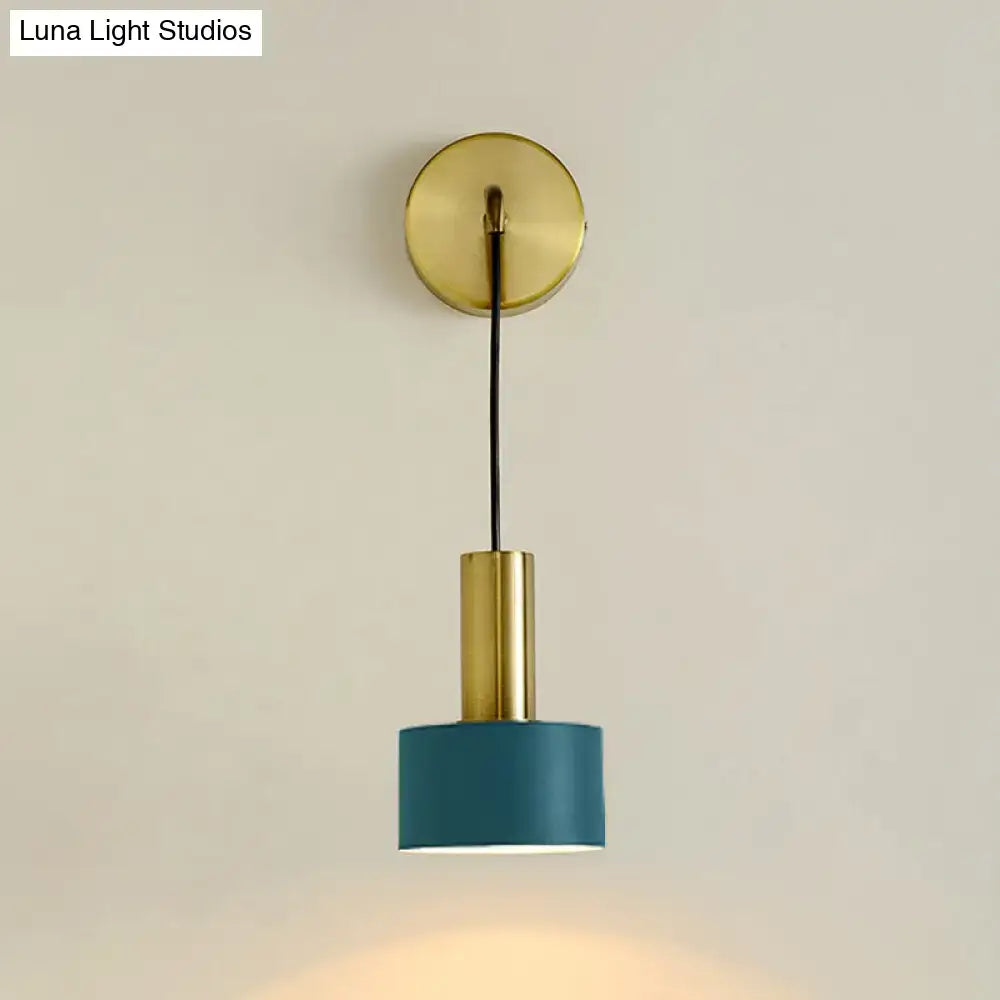 A modern brass bedside reading wall sconce with a teal cylindrical shade and black cord compatible with e14 e26 e27 bulbs