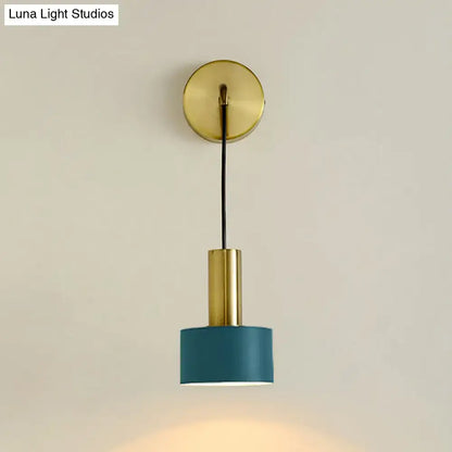 A modern brass bedside reading wall sconce with a teal cylindrical shade and black cord compatible with e14 e26 e27 bulbs