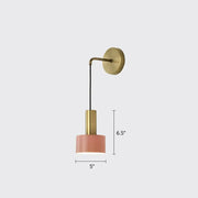 A modern pink and brass bedside reading lamp with a brass arm, circular base, and cylindrical shade for e14 e26 e27 bulbs