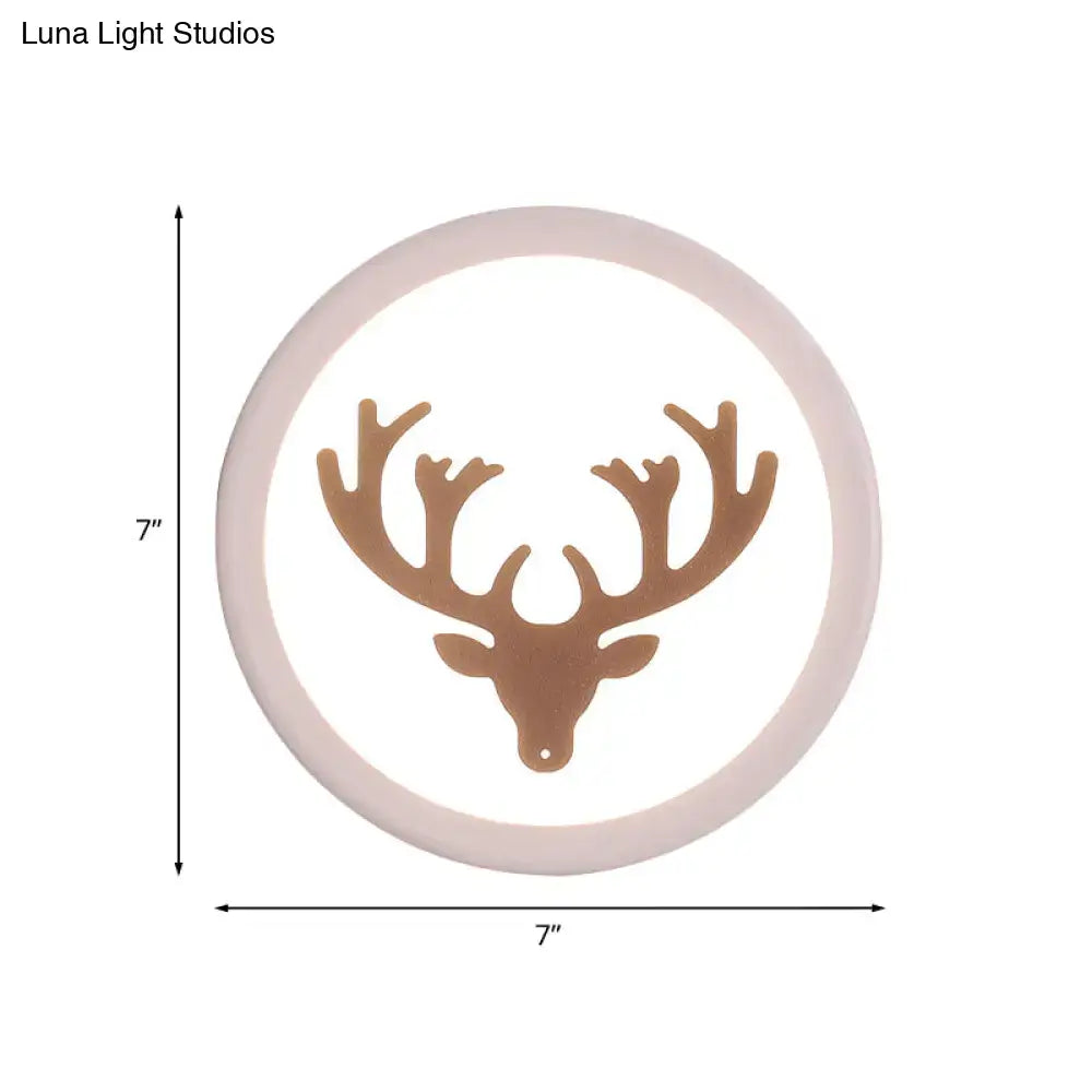 Modern pink and white deer horn bedside light circular wall sconce with matte beige frame and bronze deer head silhouette inch fixture