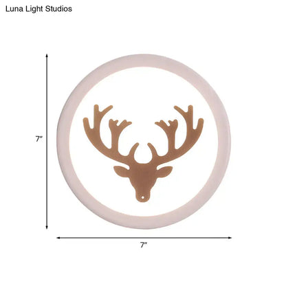 Modern pink and white deer horn bedside light circular wall sconce with matte beige frame and bronze deer head silhouette inch fixture