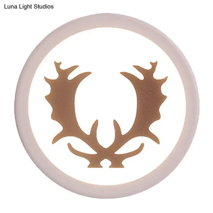 Modern pink and white deer horn bedside light with a circular white led inch fixture and bronze antler design center