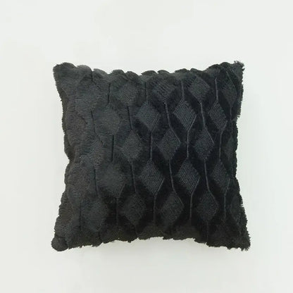 Black textured throw pillow with diamond-patterned weave and frayed edges as a modern diamond embroidery cushion cover