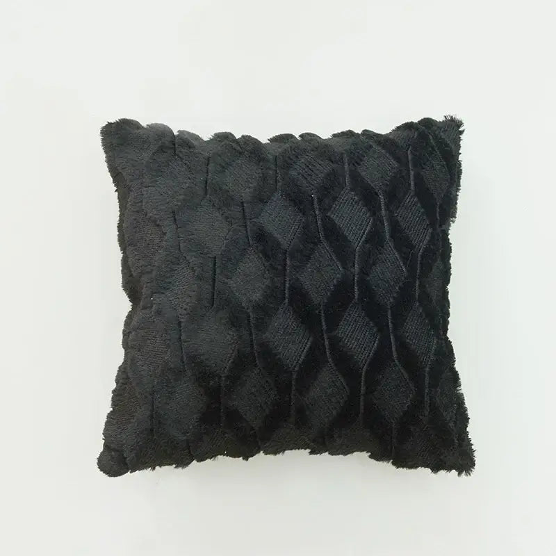 Black textured throw pillow with diamond-patterned weave and frayed edges as a modern diamond embroidery cushion cover