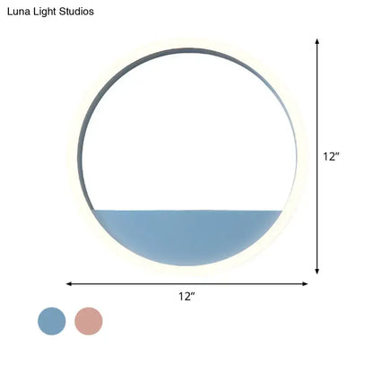 Modern pink blue iron hoop wall light with circular 12-inch led sconce, matte frame, and softly glowing blue diffuser