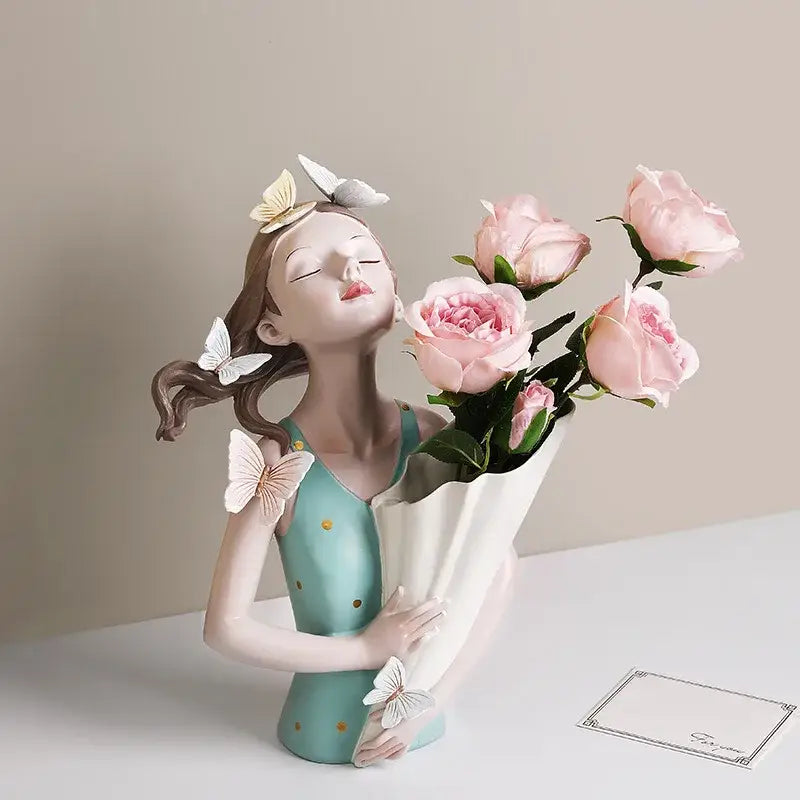Porcelain butterfly girl sculpture in teal dress with gold polka dots and pink roses for modern living room decorbites decor
