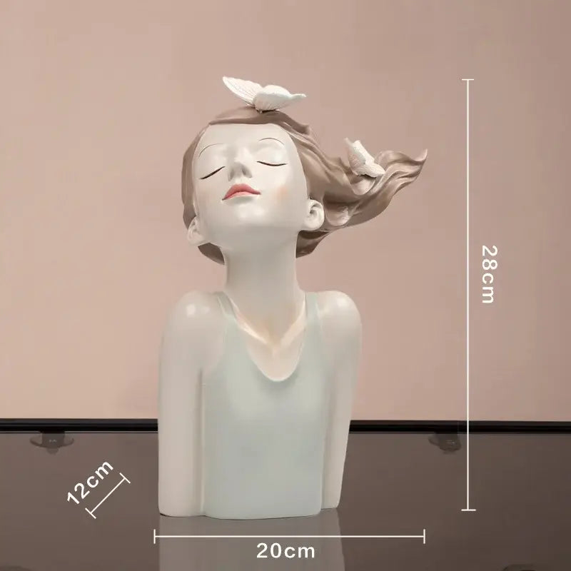 A modern pink resin butterfly girl sculpture vase featuring a serene porcelain figurine with flowing hair and white butterflies