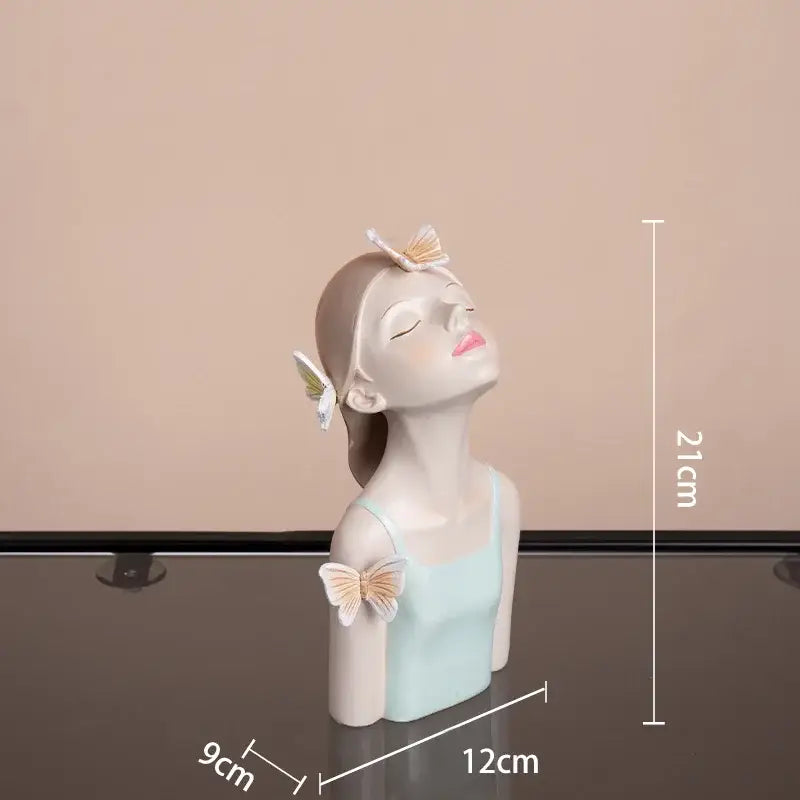 A matte-finish modern pink butterfly girl sculpture resin figurine with butterflies for living room decorbites decor