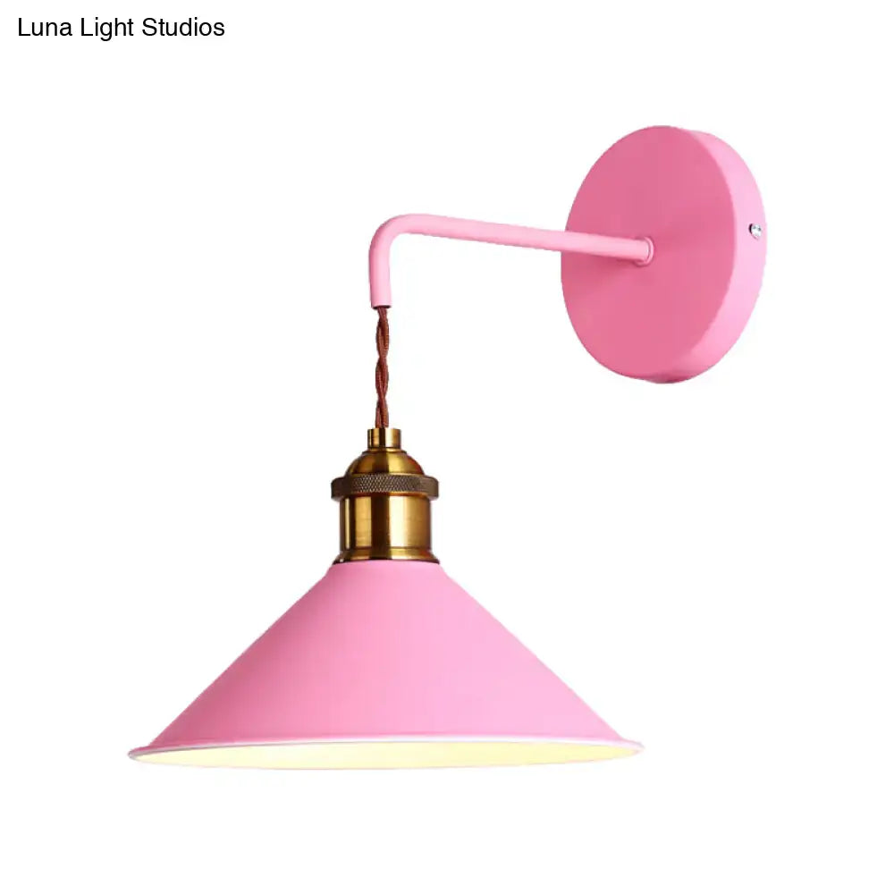 Modern pink conical metal wall sconce with brass socket and twisted cord for gray pink hallway lighting