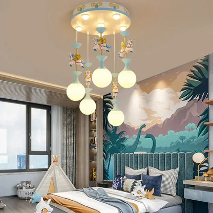 Modern pink and gold unicorn led chandelier with blue decorative top and glowing bulbs for girls bedroom decorbites kids led
