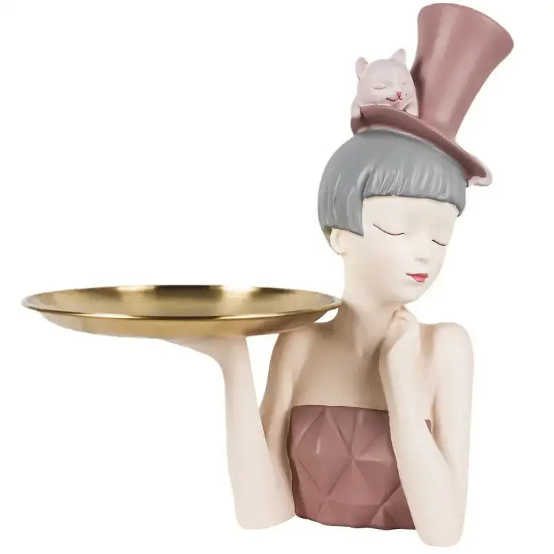 A whimsical modern pink and gray resin sculpture tray with an elegant woman and sleeping cat for home decor