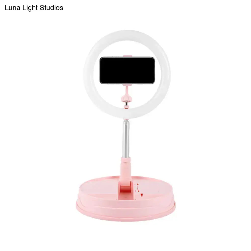 Modern pink metallic led flash light ring with adjustable white smartphone holder for streaming and photography use