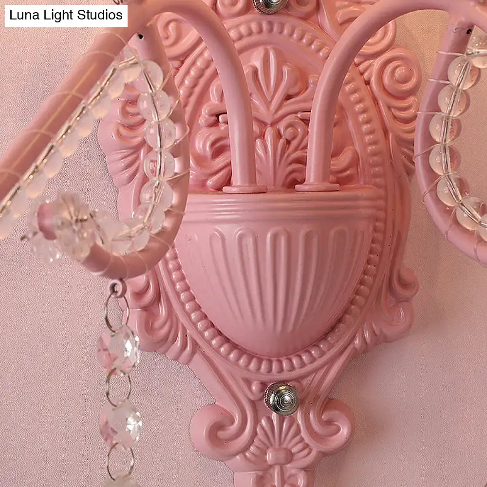 Modern pink wall lamp with metallic scroll arm and crystal beads decorative bedroom sconce lighting fixture