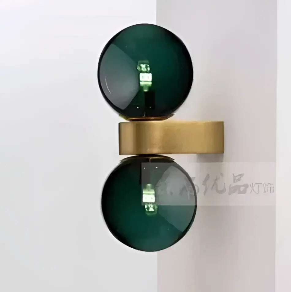 Dark green glass globe wall lamp with brass-colored metal base for modern decorbites glass ball led bedroom sconce