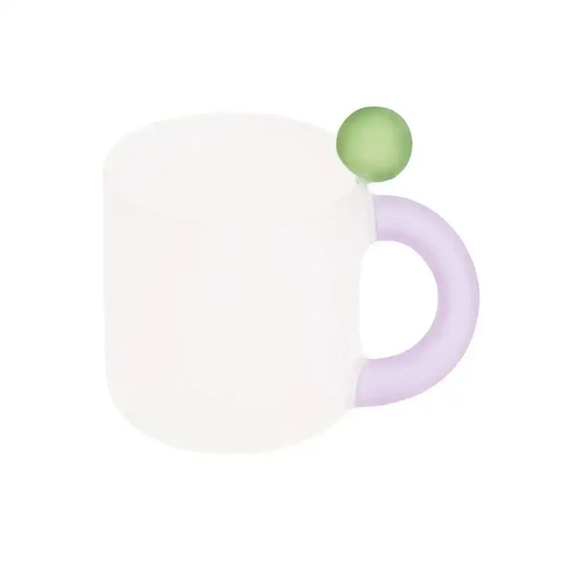 A frosted white ceramic mug with lavender handle and green accent from modern pink and red glass mug set