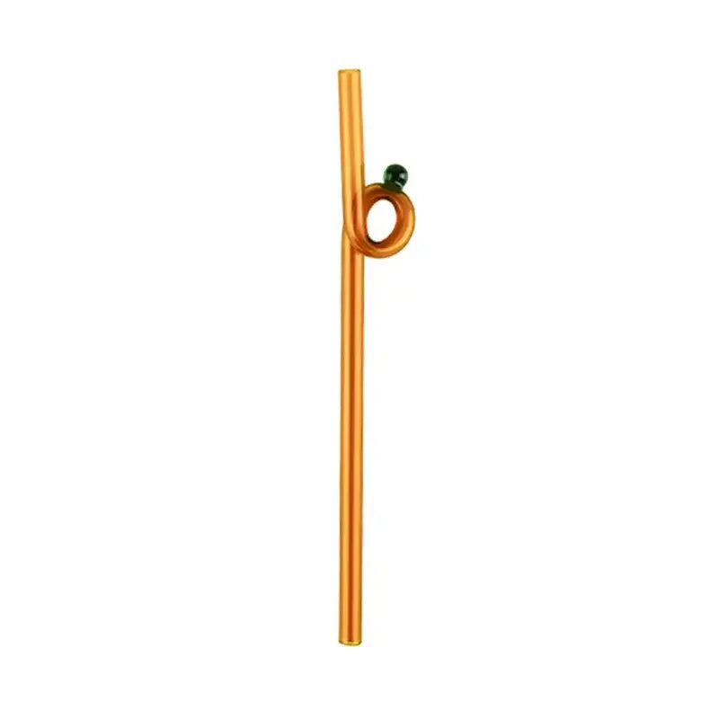 Golden glass straw with twisted loop and green bead accent paired with modern pink and red glass mug set for dining room use
