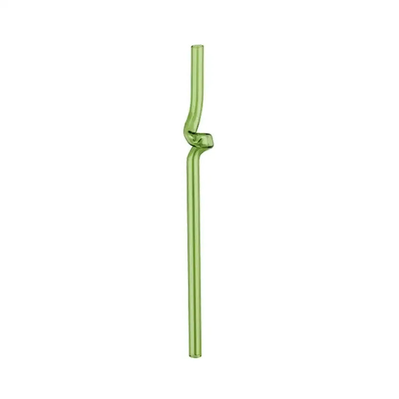 Translucent green glass straw with twisted knot design paired with modern pink and red glass mug set for dining room use