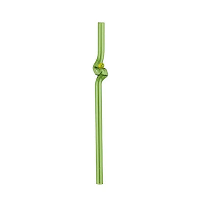 A translucent green glass straw with a decorative knot and yellow bead accent paired with a modern pink and red glass mug set