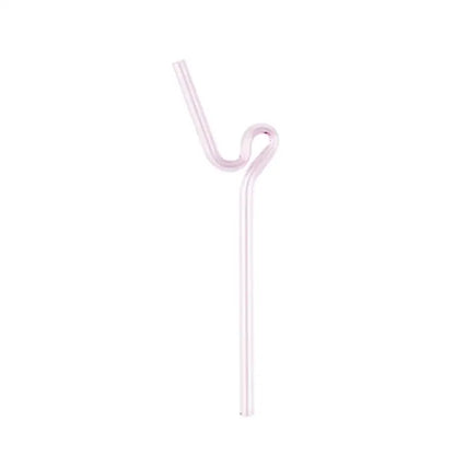 A translucent pink glass straw with a curved ergonomic design in a modern pink and red glass mug set for dining and dessert