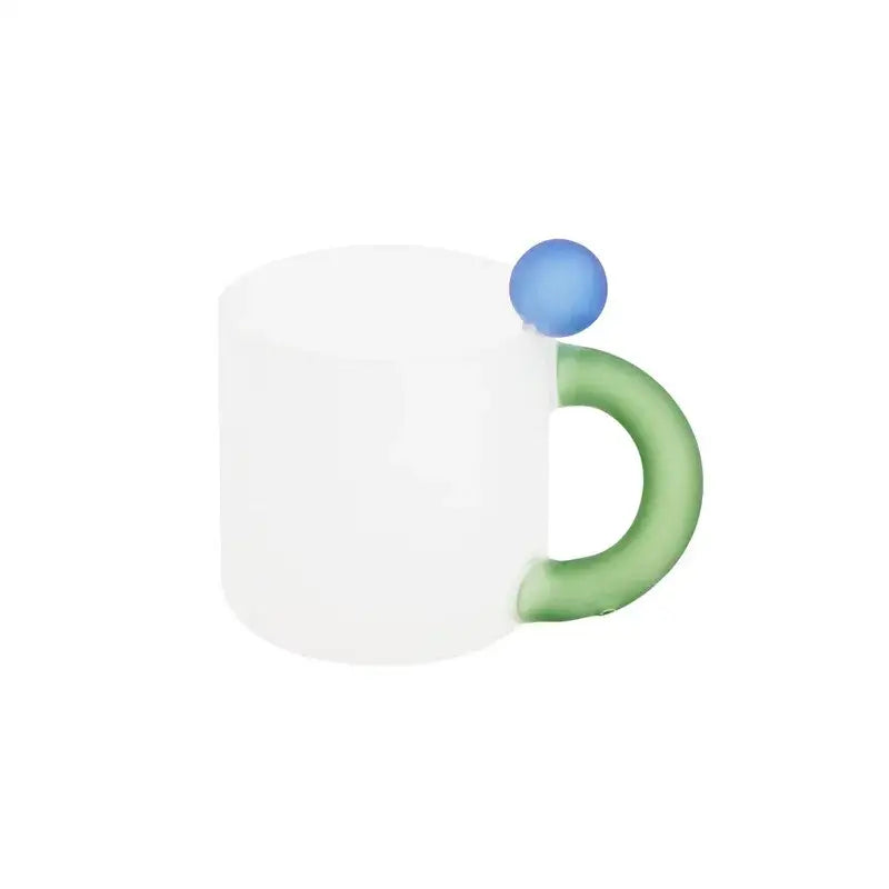 Modern pink and red glass mug set featuring a white ceramic mug with green handle and blue rim accent