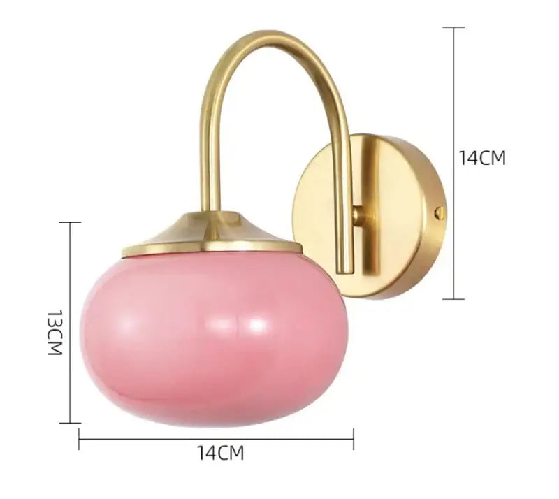Modern pink and white glass ball wall lamp with pink frosted glass globe and gold-toned metal bracket for living room lighting decorbites glass ball wall