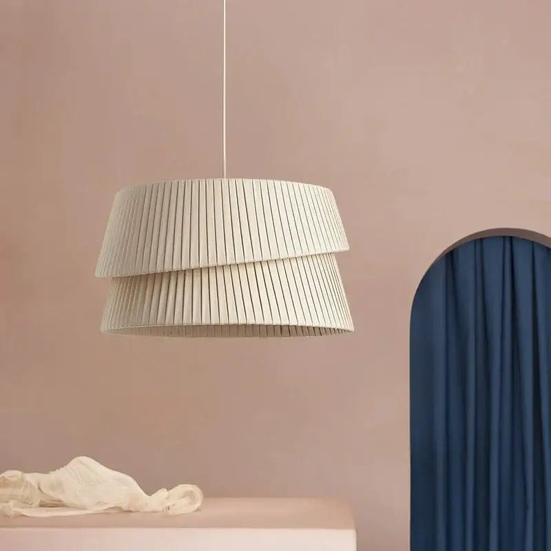 A modern pleated cream led ceiling chandelier with tiered design hangs elegantly for living room decorbites cream led