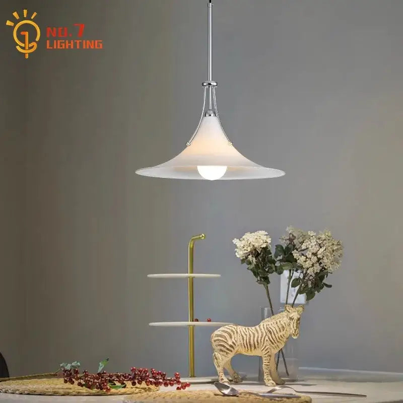 A sleek modern pendant light with frosted white glass and polished chrome finish for decorbites french medieval use