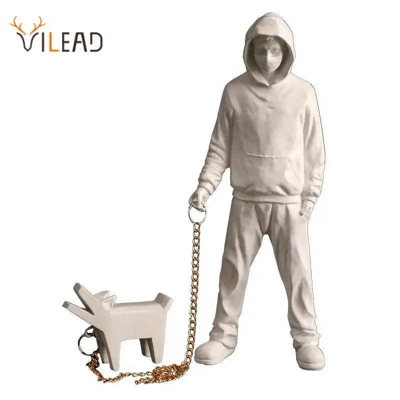 Modern pop art white resin decorbites dog sculpture of a person in hoodie holding a gold chain leash with dog keychain