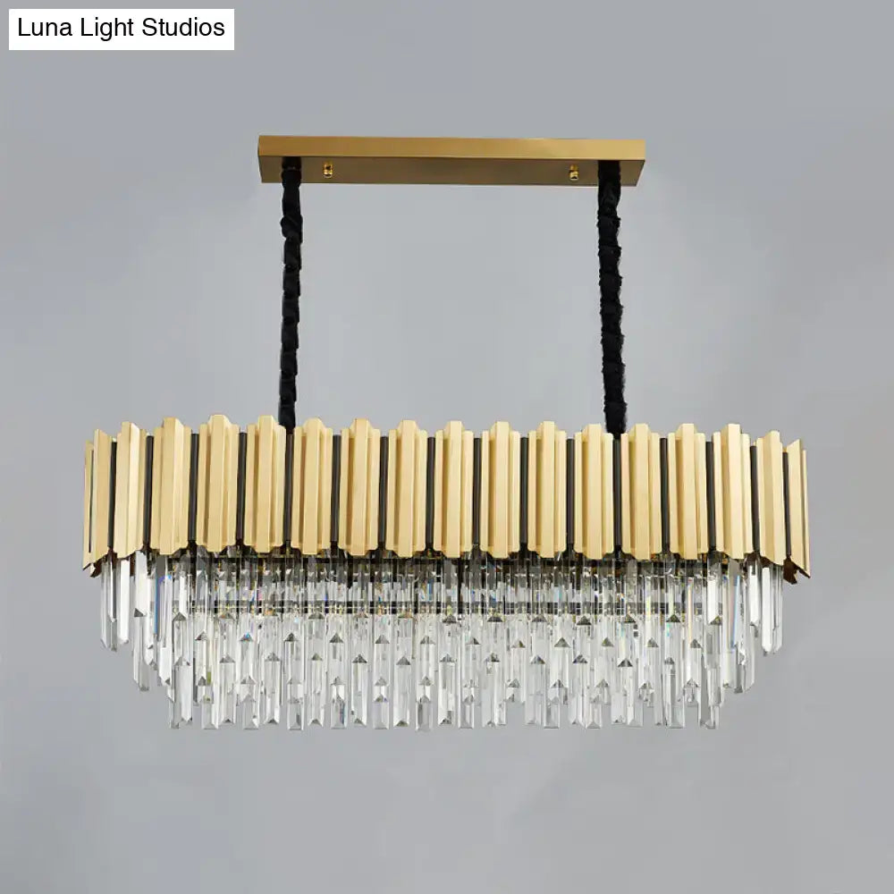 Gold finish pendant light with 10 heads featuring crystal prismatic gold oval design and vertical brass bars