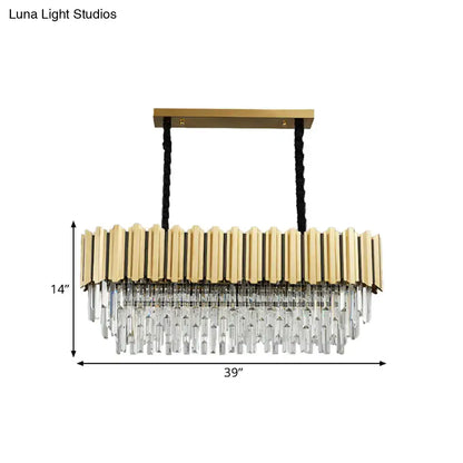 Gold-toned pendant light featuring vertical brass bars and cascading crystal prisms in a crystal prismatic gold finish