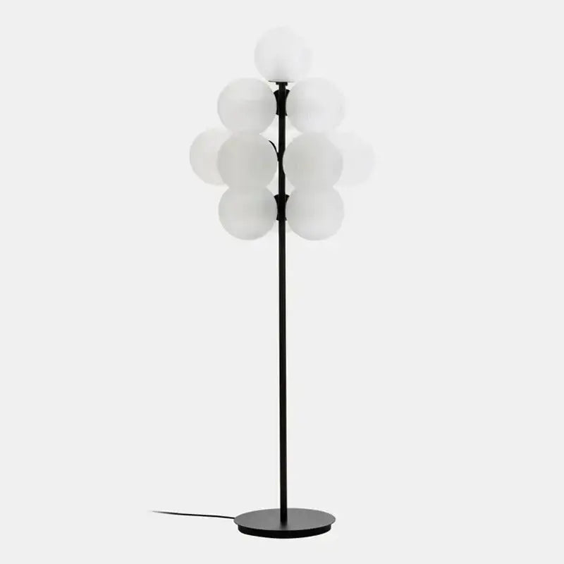 Black metal decorbites glass bubble floor lamp with frosted white globes arranged in a tree-like cluster for living room