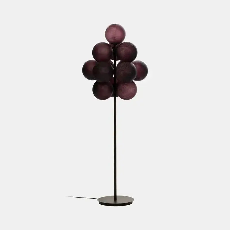 Modern purple decorbites glass bubble floor lamp with slender black metal stand and deep purple glass orbs for living room