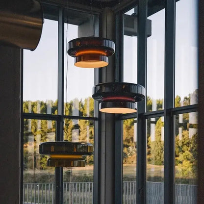 Modern amber and black glass pendant light with sleek layered design for dining room decorbites italian glass pendant